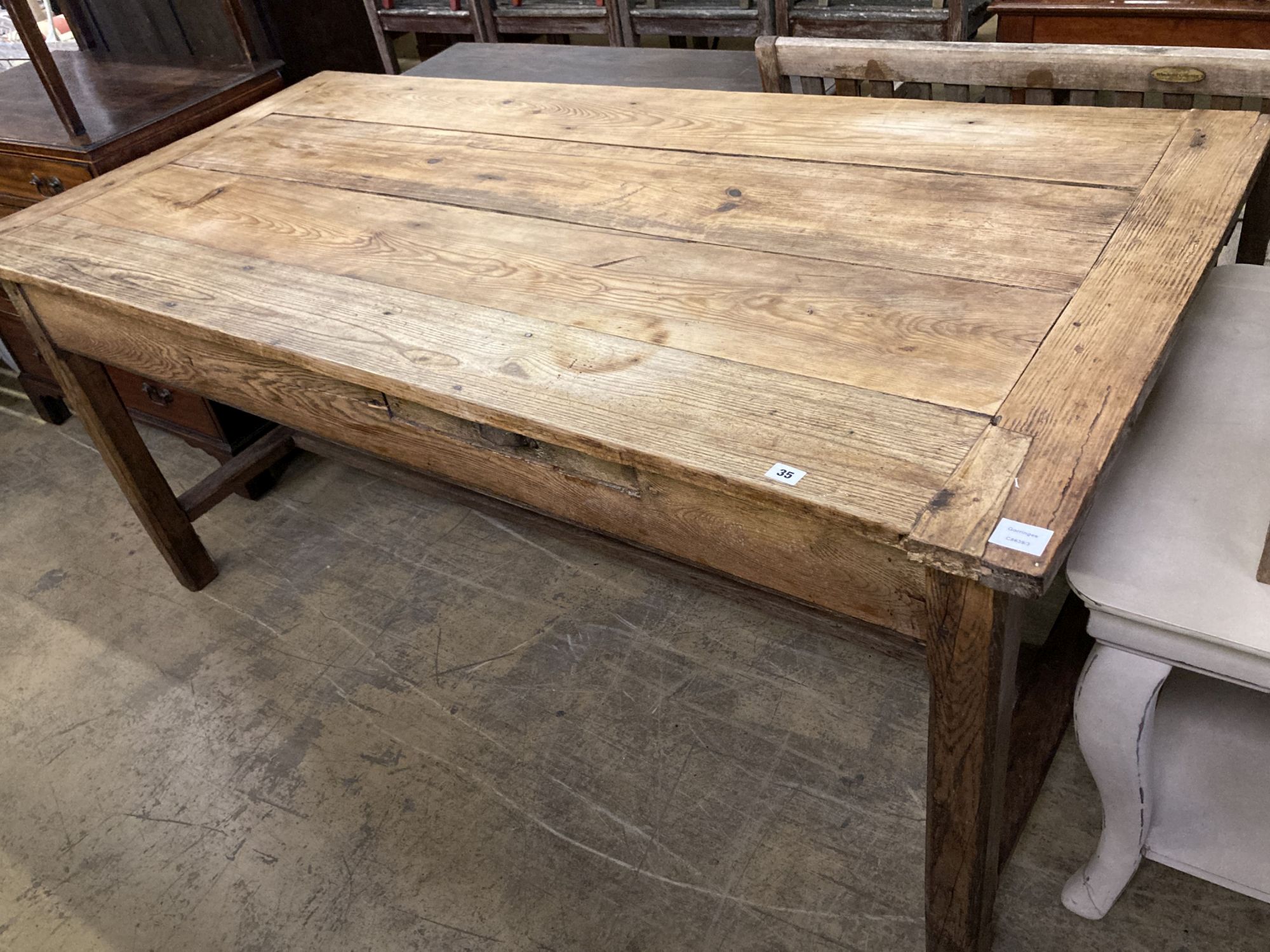 An early 19th century ash and pine rectangular kitchen table, width 186cm, depth 90cm, height 82cm